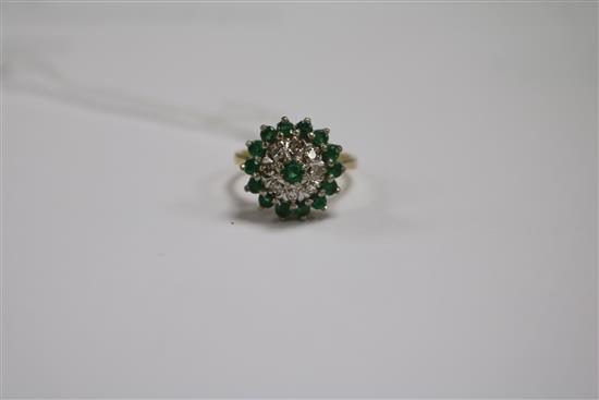 An 18ct gold, emerald and diamond cluster dress ring, size N.